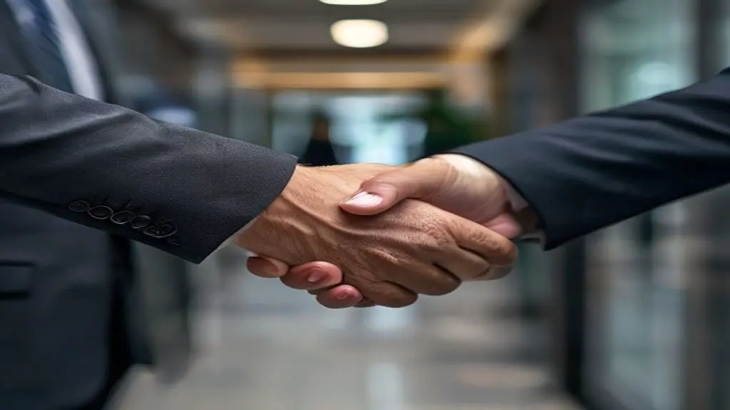 A firm handshake between two professionals in a law office hallway, symbolizing a successful new hire and a strong partnership.