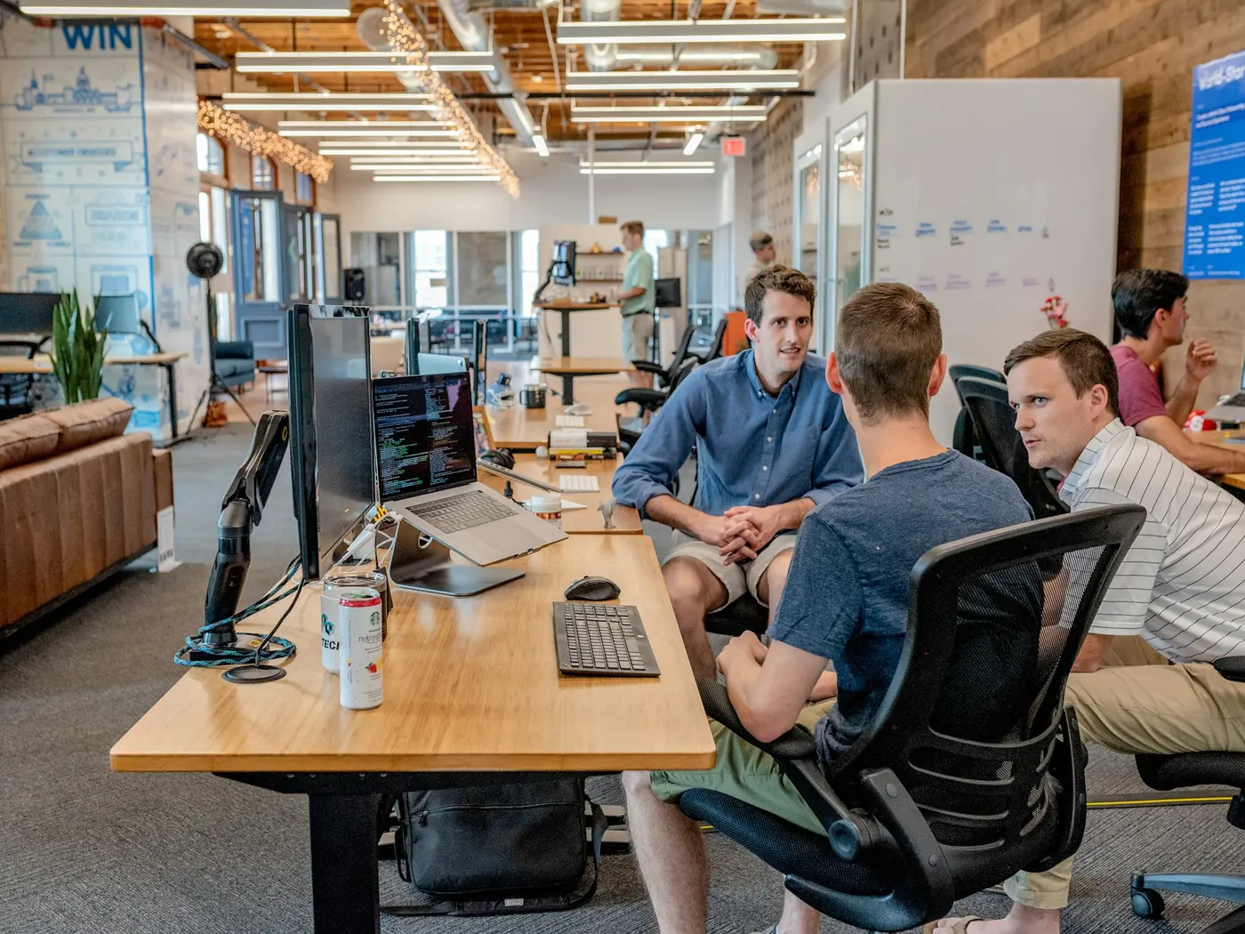 A busy, impersonal corporate office with rows of cubicles, illustrating the high-volume, transactional nature of large staffing agencies.